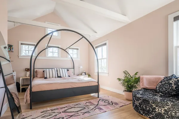 a living room with furniture and a potted plant