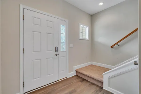 a view of room with window and hardwood floor