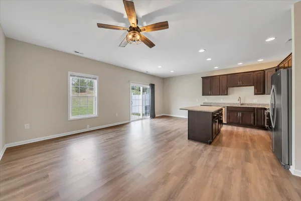 a view of kitchen with cabinets and wooden floor