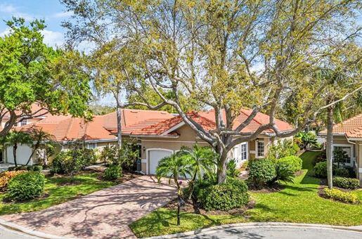 115 Napa Ridge Way Naples, FL 34119 - Photo 1 of 1 a front view of a house with a yard
