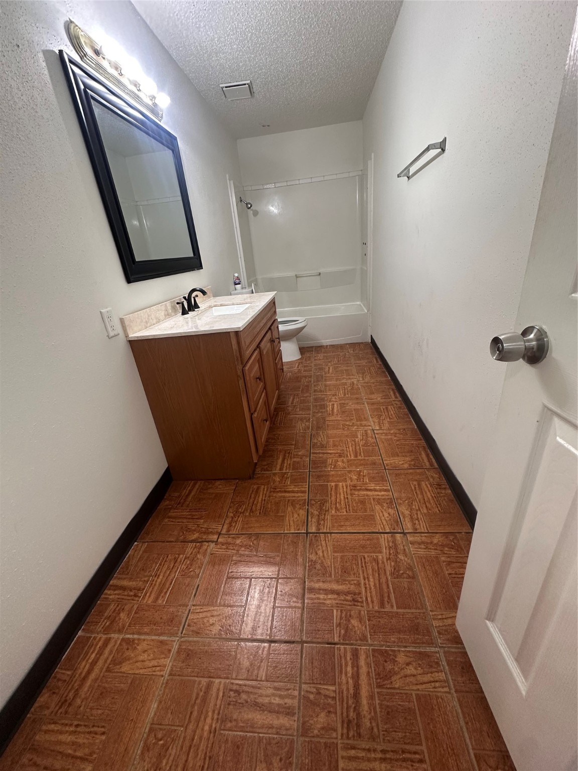 15522 Blake Way Street Houston, TX 77032 - Photo 7 of 19 a bathroom with a sink a toilet and mirror
