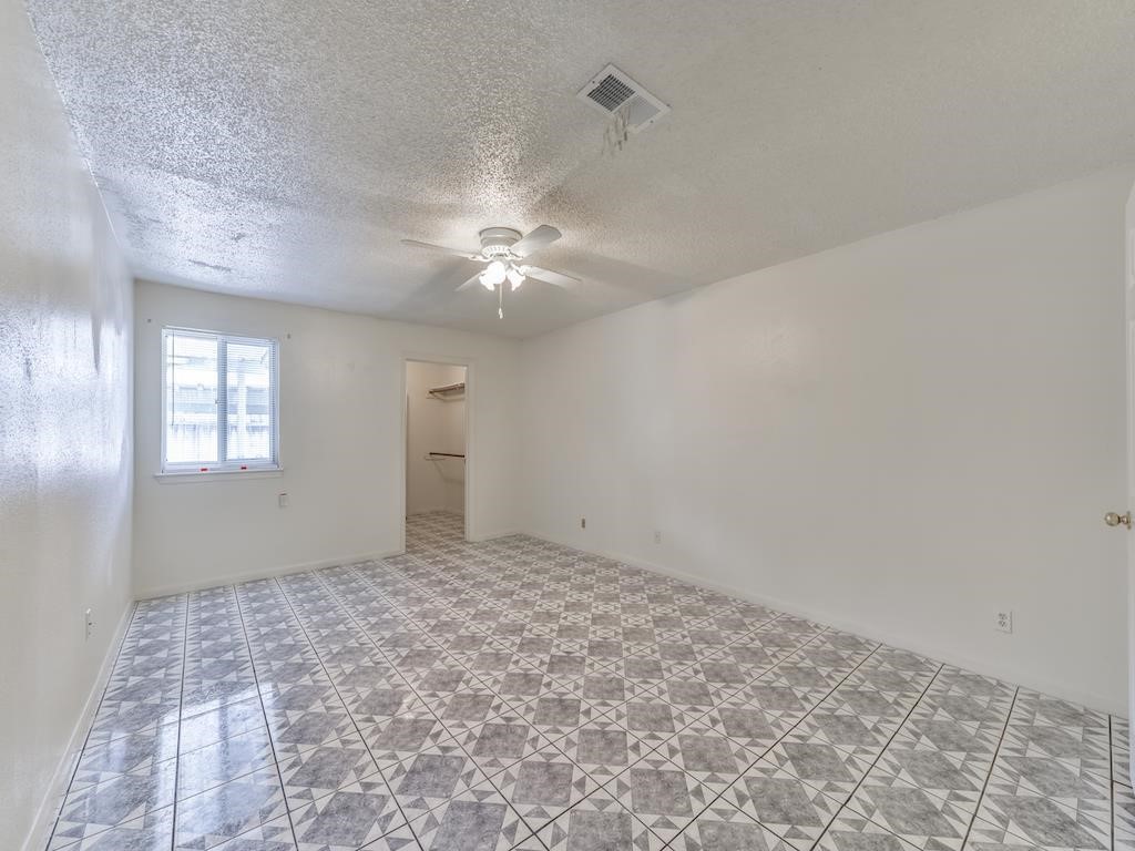 15522 Blake Way Street Houston, TX 77032 - Photo 8 of 19 a view of an empty room with a window