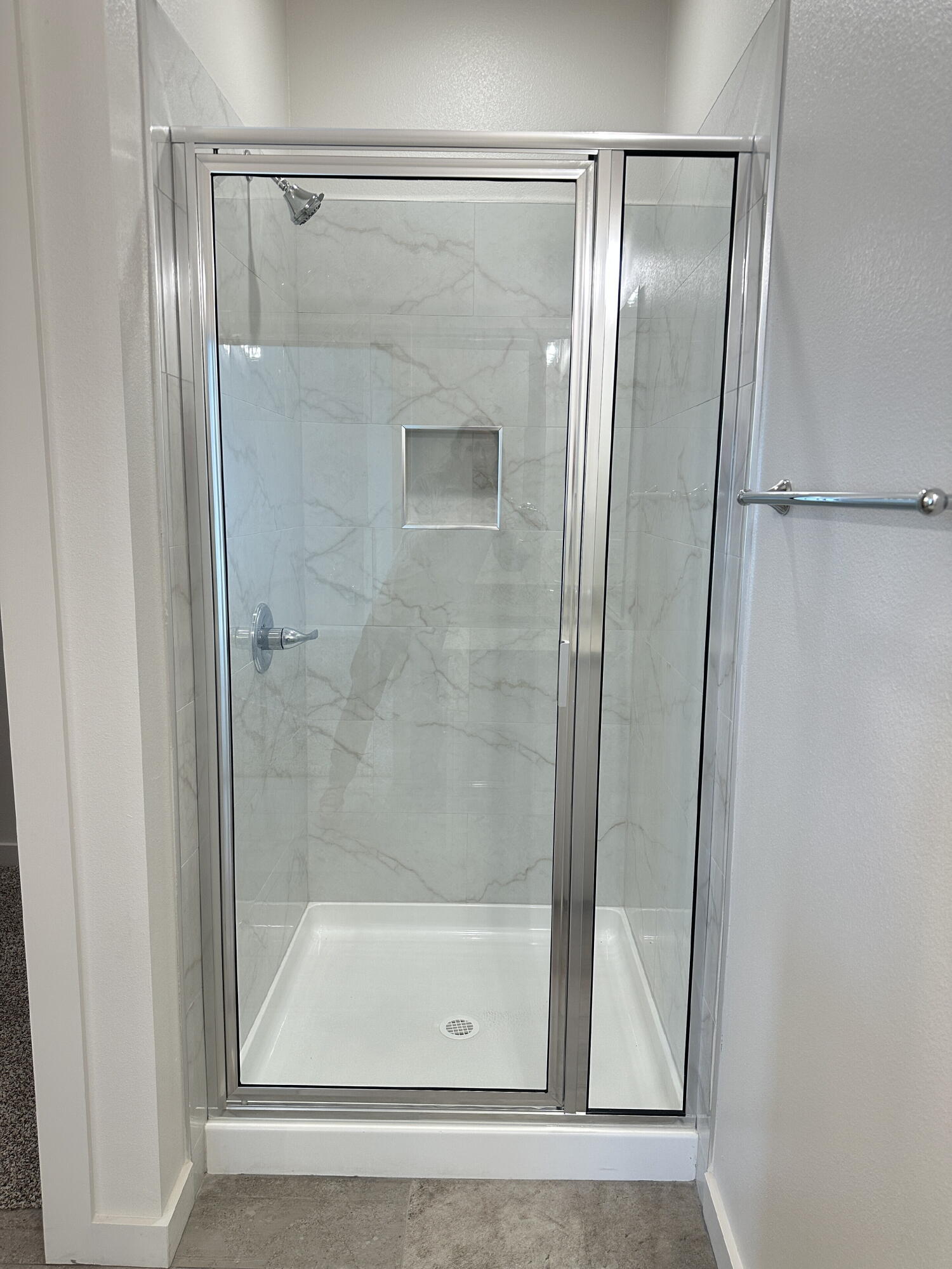 1113 North 7th Street Wolfforth, TX 79382 - Photo 11 of 17 a bathroom with a glass shower door