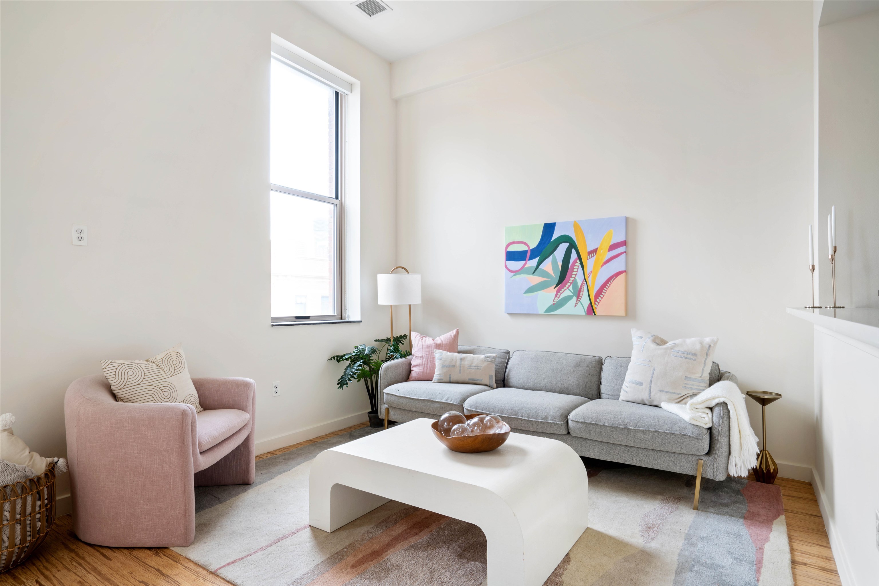 232 Pavonia Avenue, Unit 608 Jersey City, NJ 07302 - Photo 2 of 14 a living room with furniture and a window