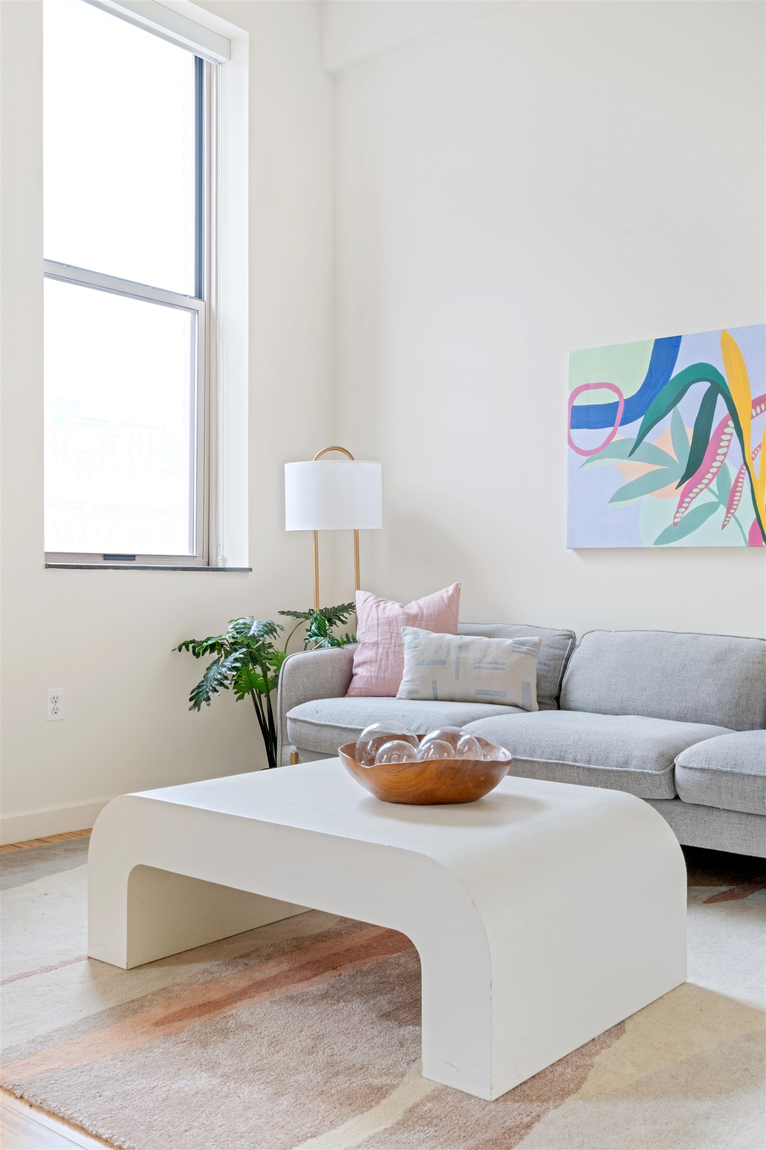 232 Pavonia Avenue, Unit 608 Jersey City, NJ 07302 - Photo 4 of 14 a living room with furniture and a potted plant