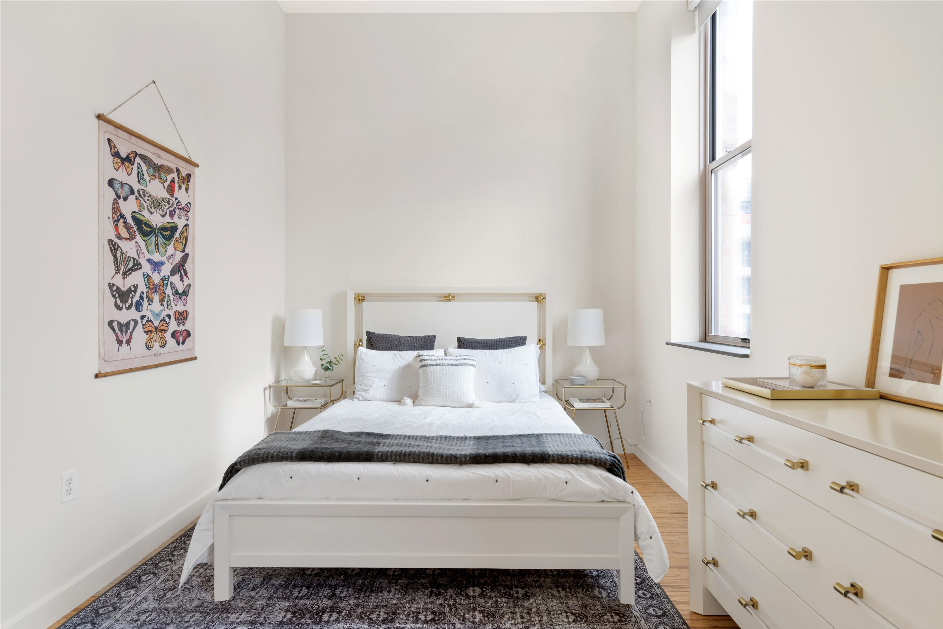 232 Pavonia Avenue, Unit 608 Jersey City, NJ 07302 - Photo 8 of 14 a bedroom with a bed and a dresser