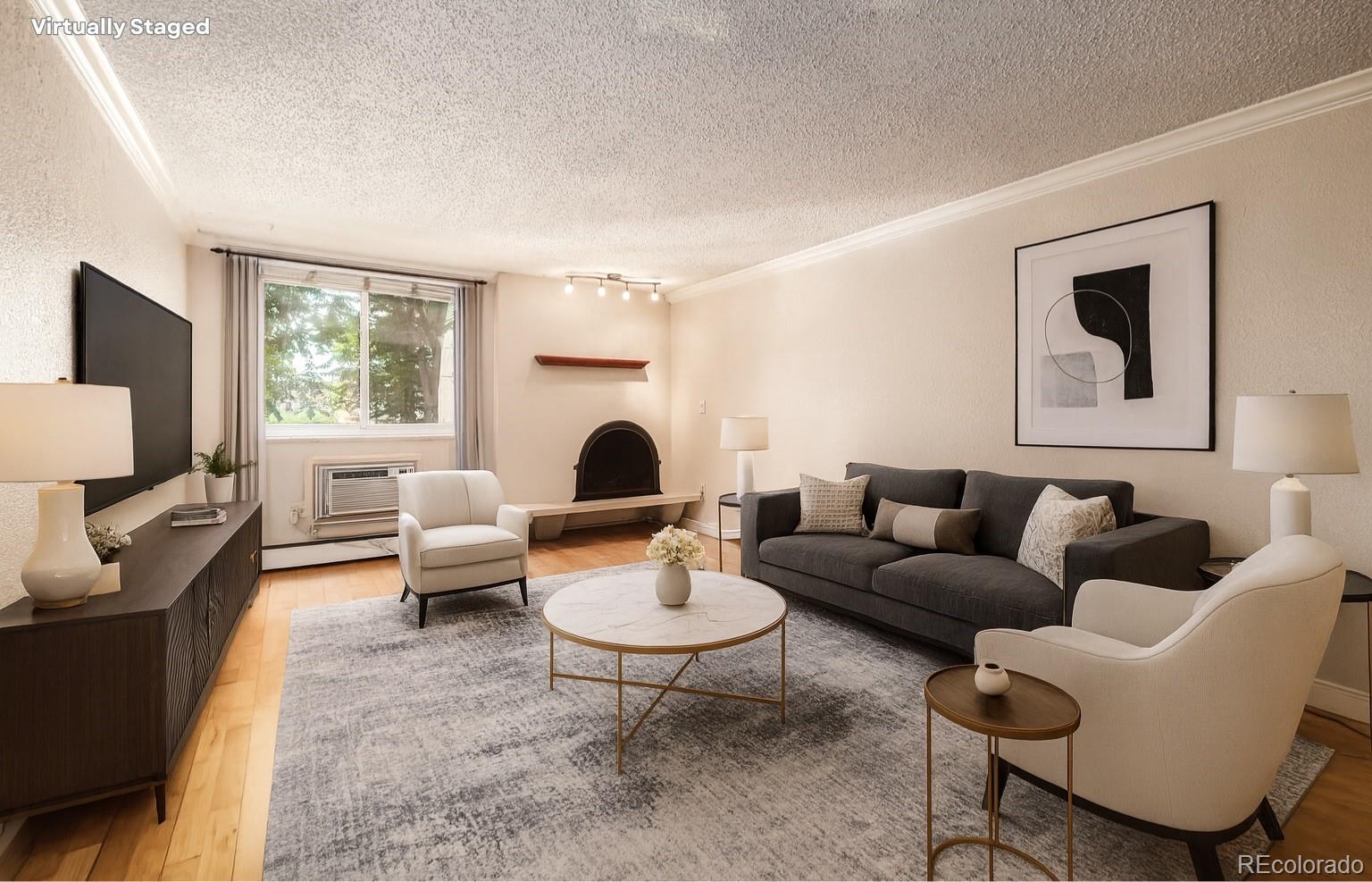 a living room with furniture and a flat screen tv