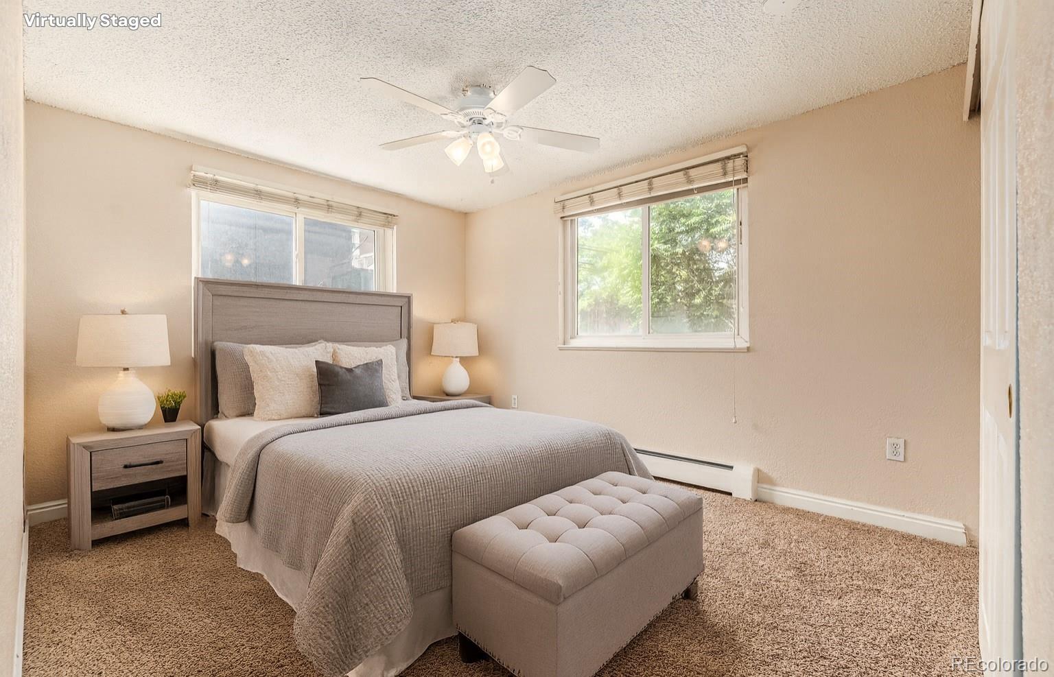 1125 North Washington Street, Unit 207 Denver, CO 80203 - Photo 2 of 33 a bedroom with bed and a night stand