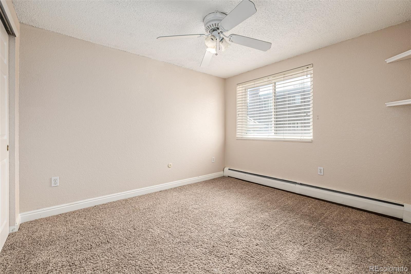 1125 North Washington Street, Unit 207 Denver, CO 80203 - Photo 21 of 33 a view of an empty room with a window