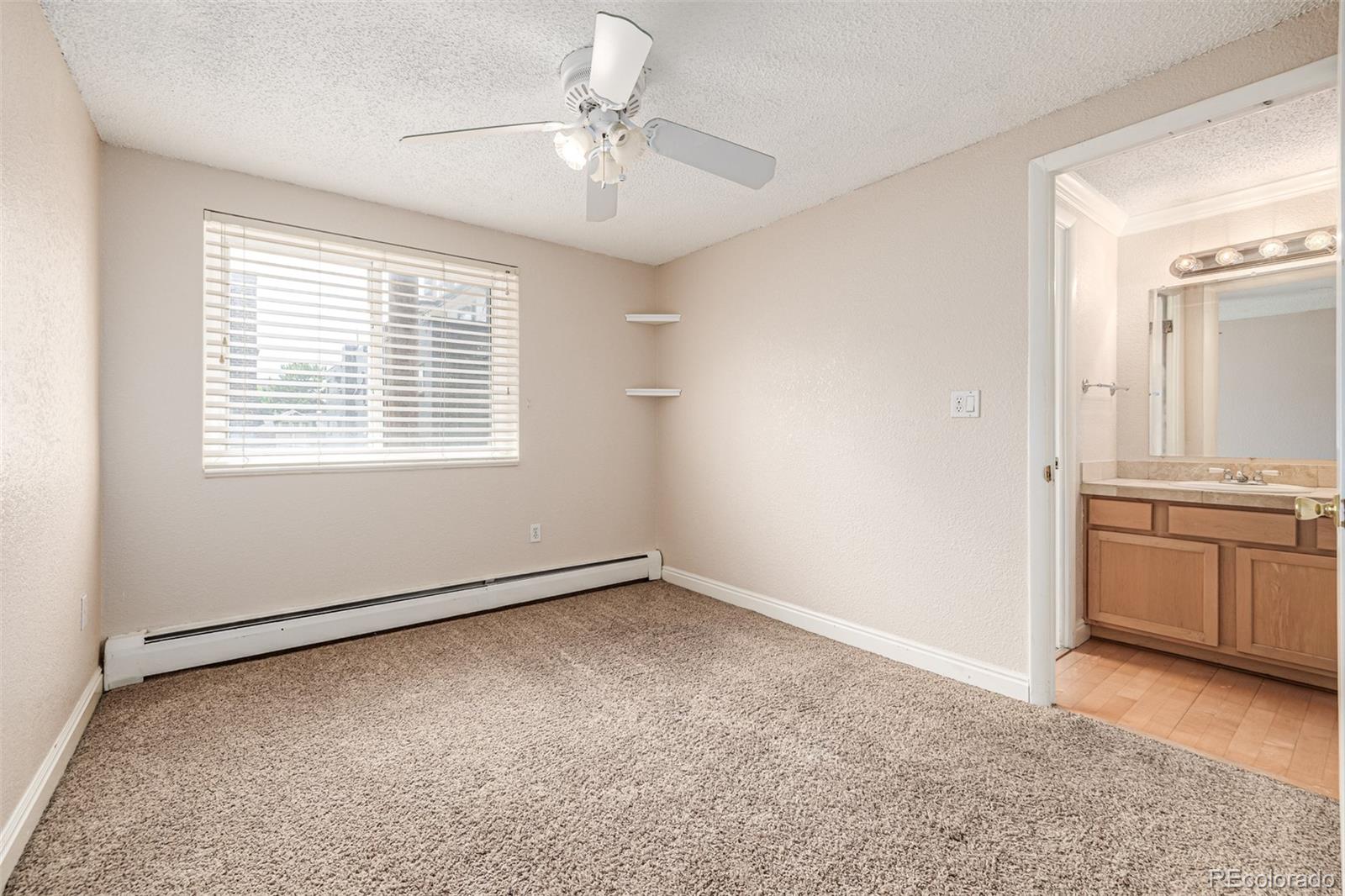 1125 North Washington Street, Unit 207 Denver, CO 80203 - Photo 23 of 33 a view of an empty room with a kitchen