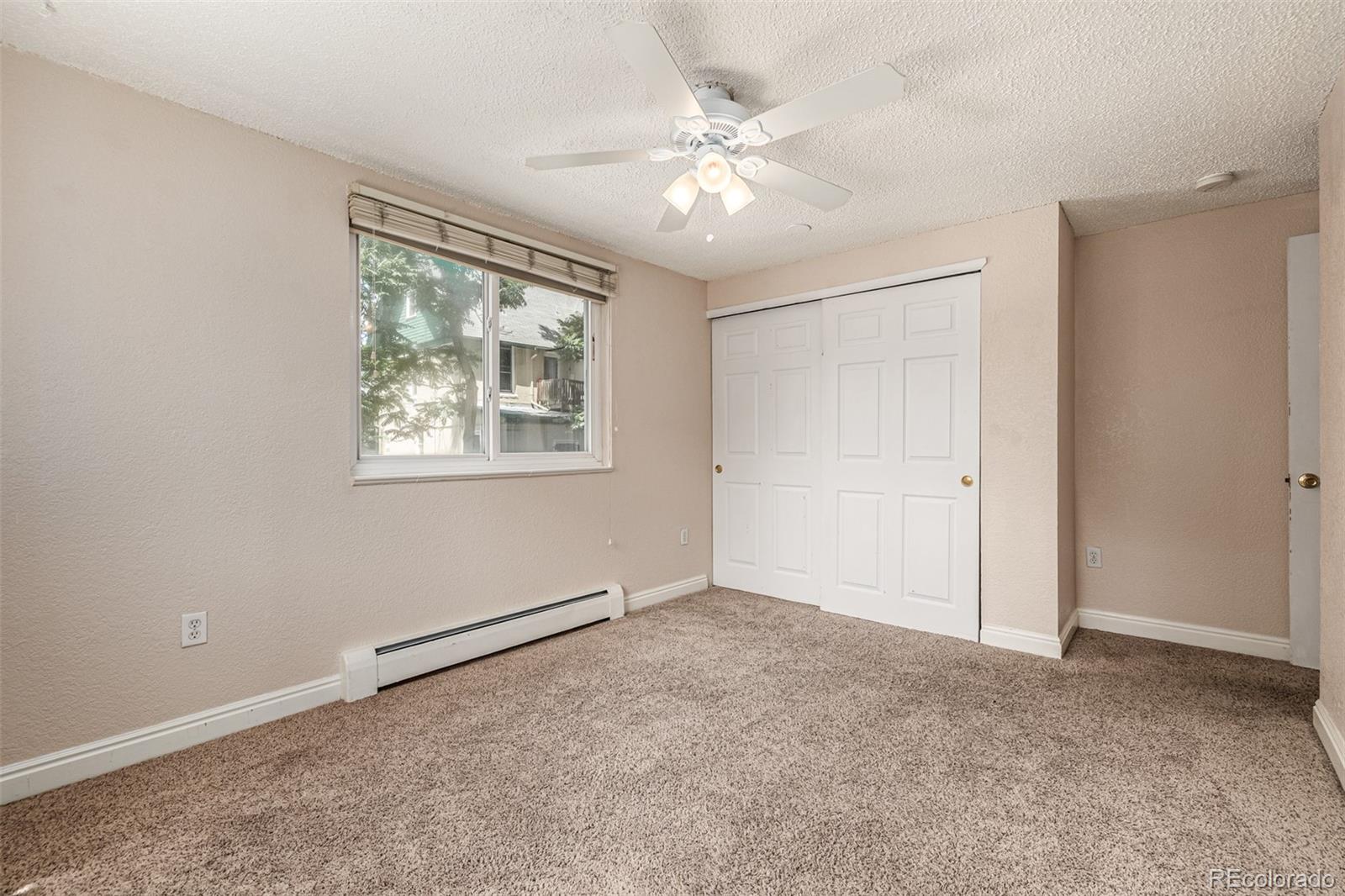 1125 North Washington Street, Unit 207 Denver, CO 80203 - Photo 26 of 33 wooden floor in an empty room with a window