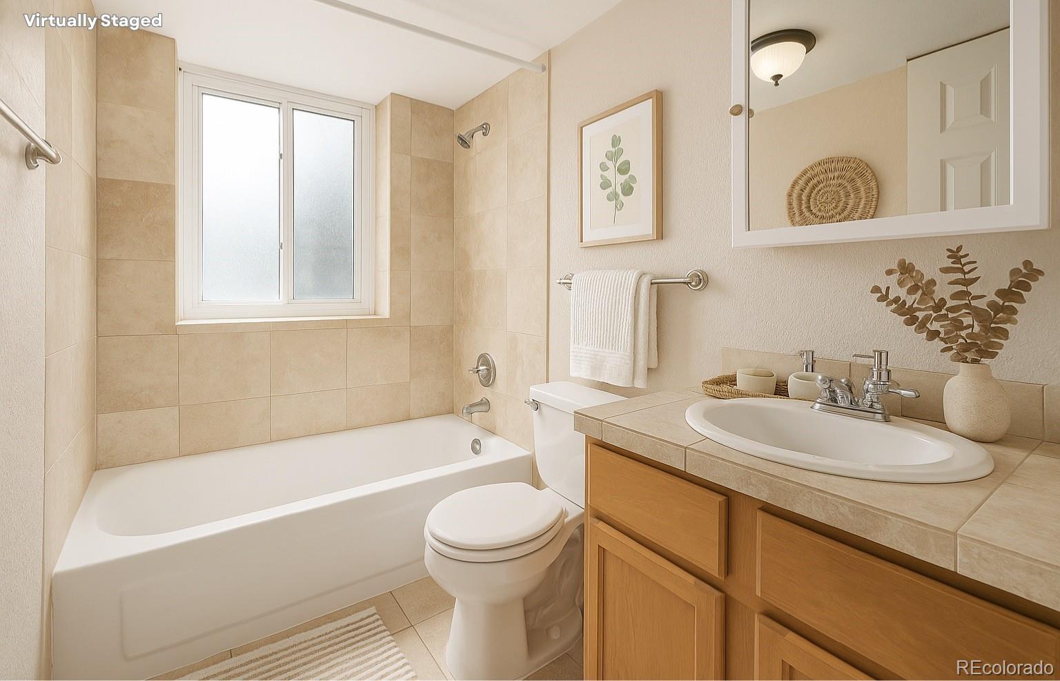 1125 North Washington Street, Unit 207 Denver, CO 80203 - Photo 4 of 33 a bathroom with a sink a toilet and a bathtub