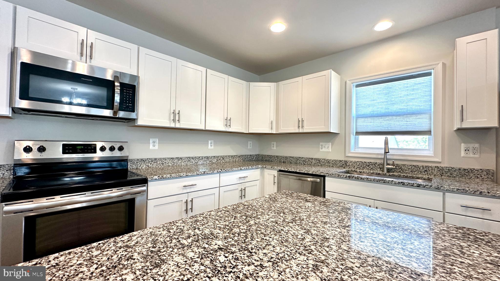 46 Lookover Terrace Stuarts Draft, VA 24477 - Photo 11 of 45 a kitchen with stainless steel appliances kitchen island granite countertop a sink and a stove