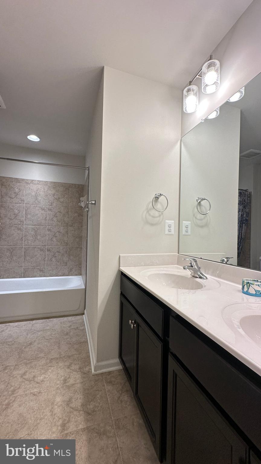 46 Lookover Terrace Stuarts Draft, VA 24477 - Photo 22 of 45 a bathroom with a sink a large mirror and a bathtub
