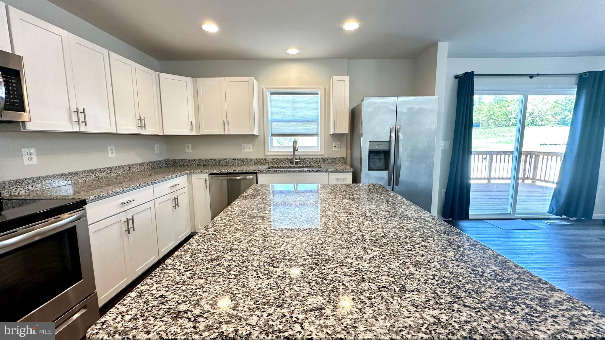 46 Lookover Terrace Stuarts Draft, VA 24477 - Photo 8 of 45 a kitchen with stainless steel appliances granite countertop a refrigerator sink and cabinets