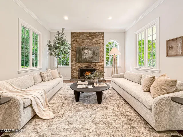 a dining room with wooden floor and window