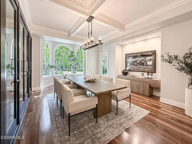 a kitchen with granite countertop a sink appliances cabinets and a window