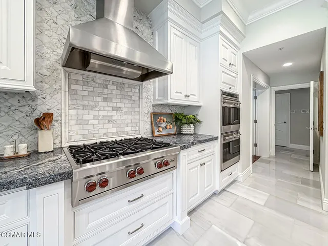 a bedroom with a large bed and a couch