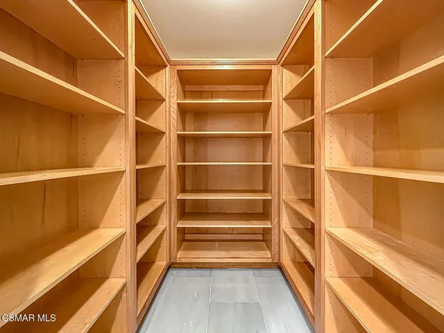 a bathroom with a glass shower door and a sink