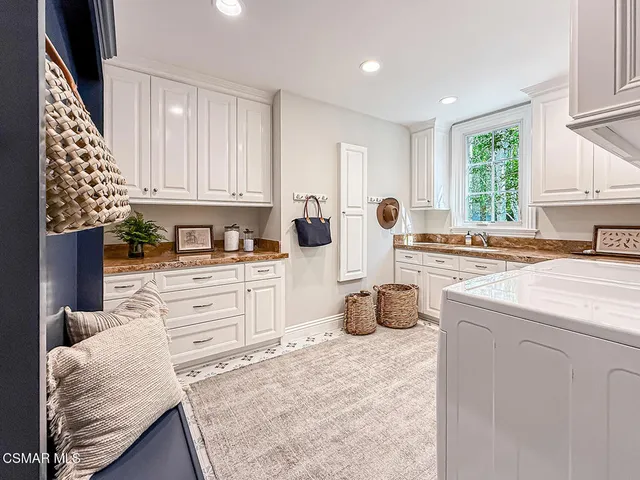 a bath tub sitting in a bathroom next to a window