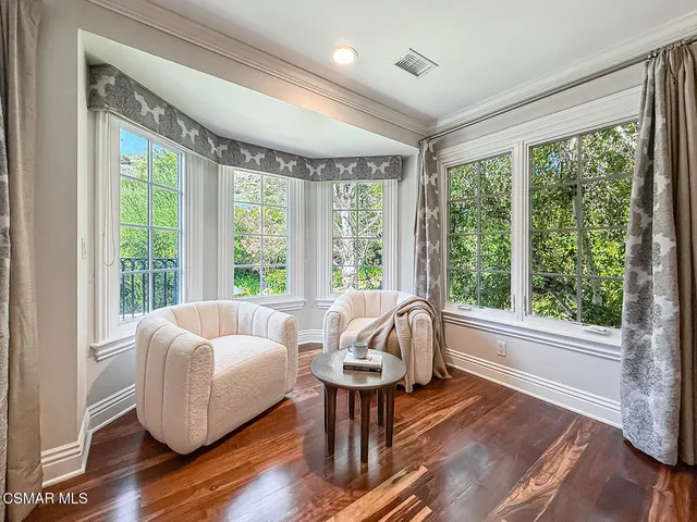 a view of a chairs and table in the patio