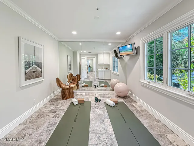 an aerial view of multiple houses with yard