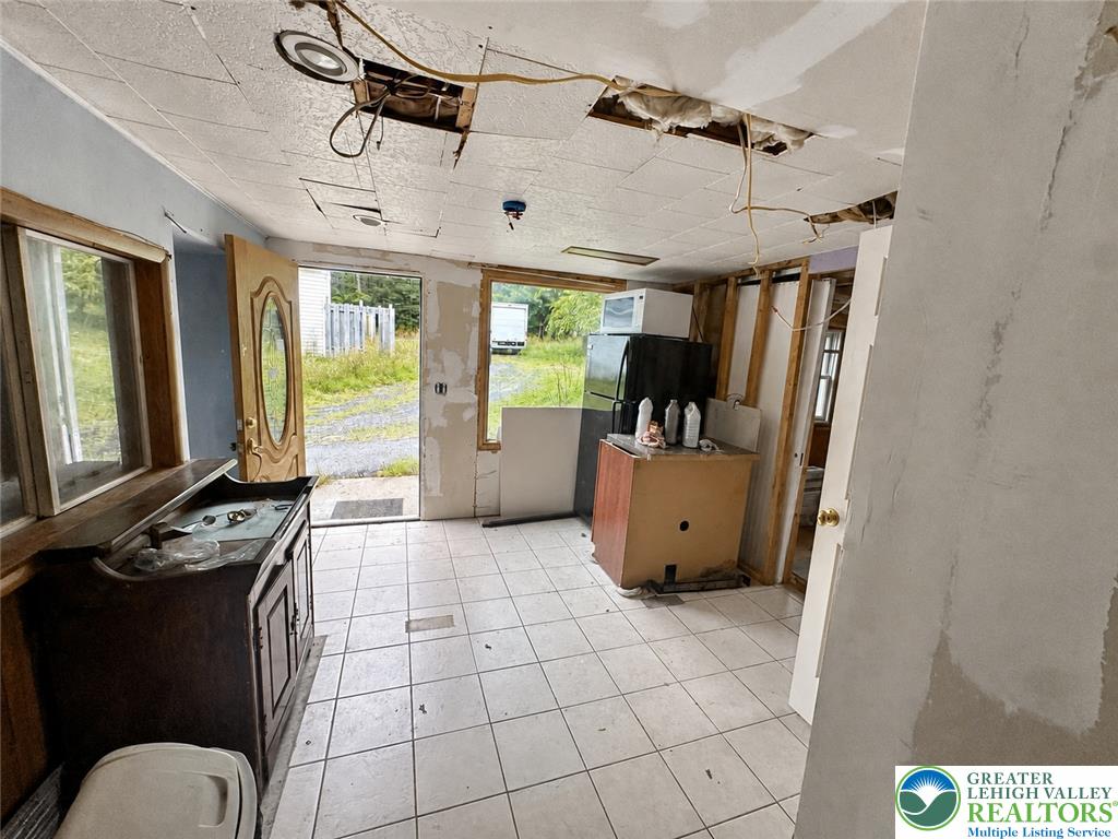 3540 Mountain Road, Unit 3538 Slatington, PA 18080 - Photo 19 of 27 Tiled flooring runs throughout this interior space currently undergoing renovations.