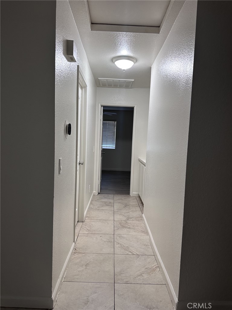 11807 Lupin Road Adelanto, CA 92301 - Photo 2 of 8 a view of a hallway