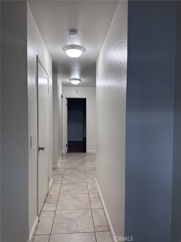 11807 Lupin Road Adelanto, CA 92301 - Photo 5 of 8 a view of a hallway