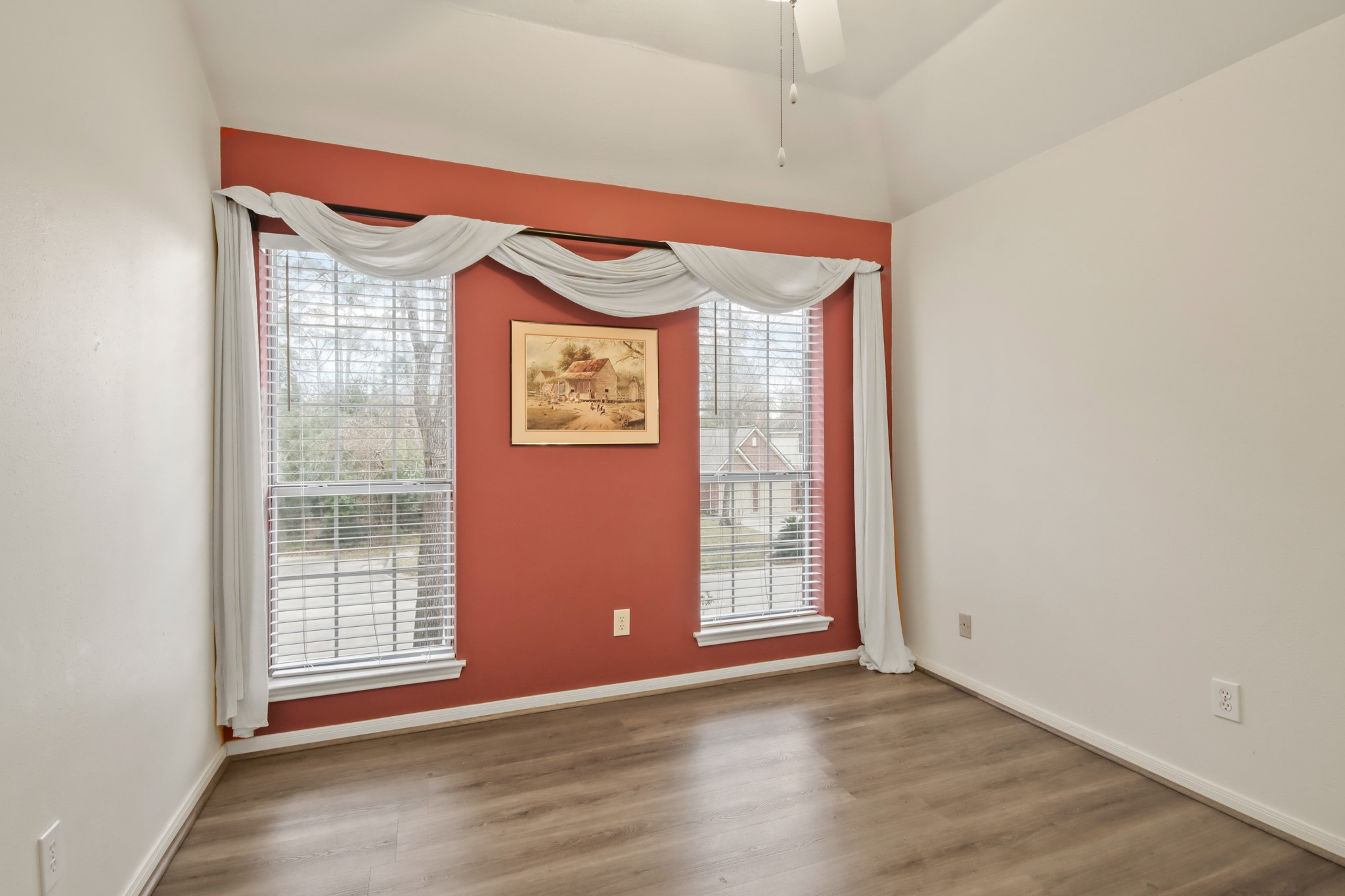 111 South Dreamweaver Circle Spring, TX 77380 - Photo 16 of 30 a view of an empty room with a window and wooden floor