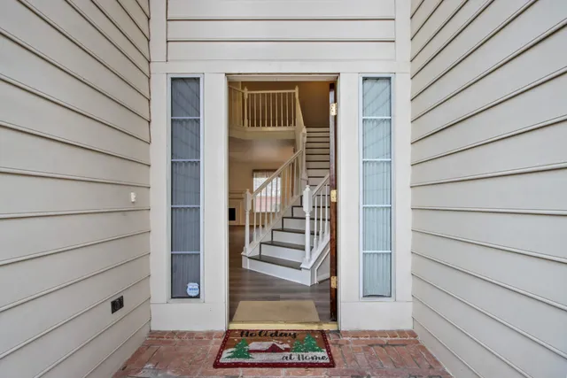 a view of wooden door and a wooden bench