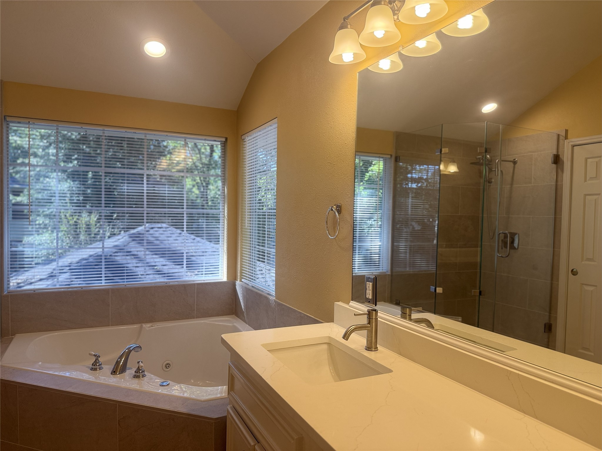 111 South Dreamweaver Circle Spring, TX 77380 - Photo 22 of 30 a bathroom with a tub sink and mirror