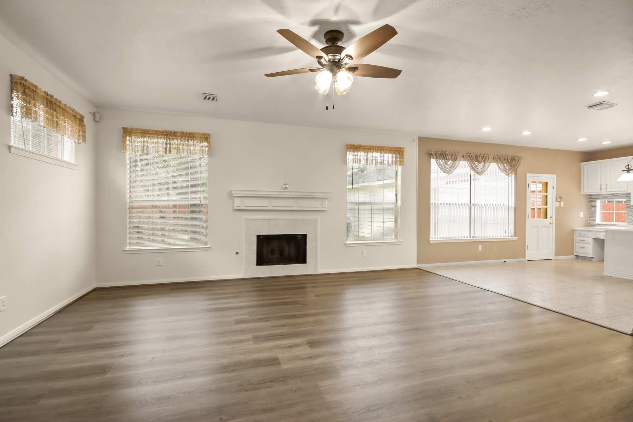 111 South Dreamweaver Circle Spring, TX 77380 - Photo 3 of 30 a view of an empty room with a window and wooden floor