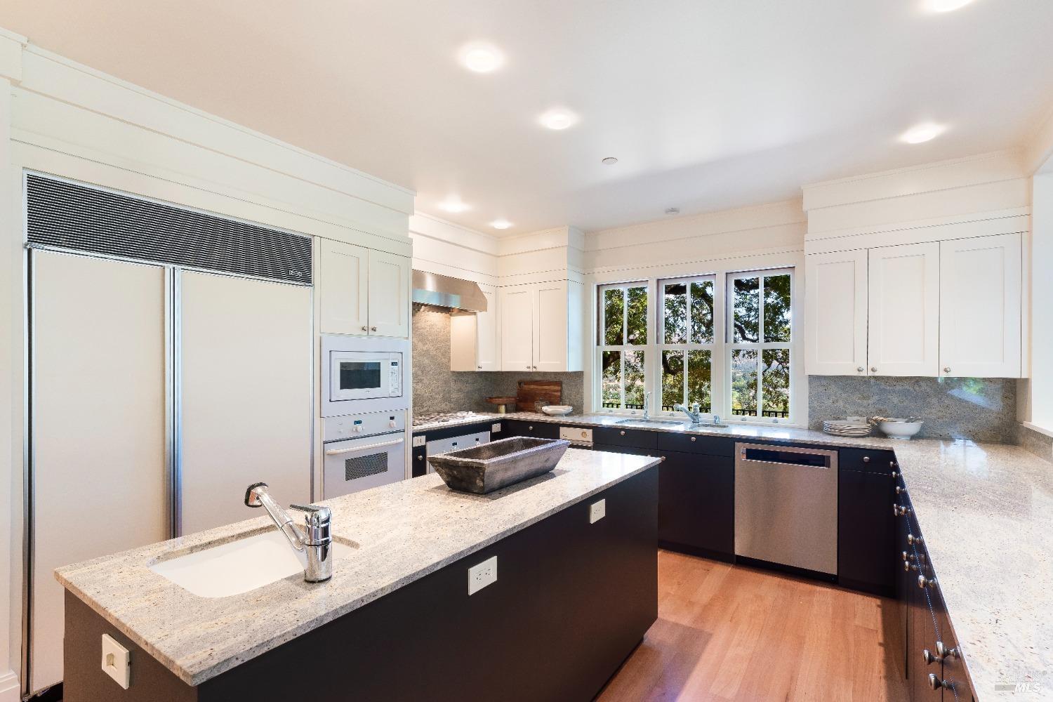 775 White Oak Drive Santa Rosa, CA 95409 - Photo 10 of 62 a kitchen with stainless steel appliances granite countertop a sink stove and refrigerator