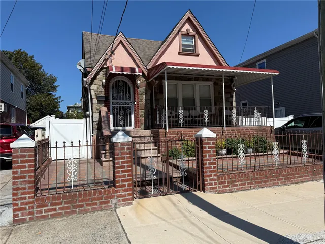 a front view of a house with glass doors