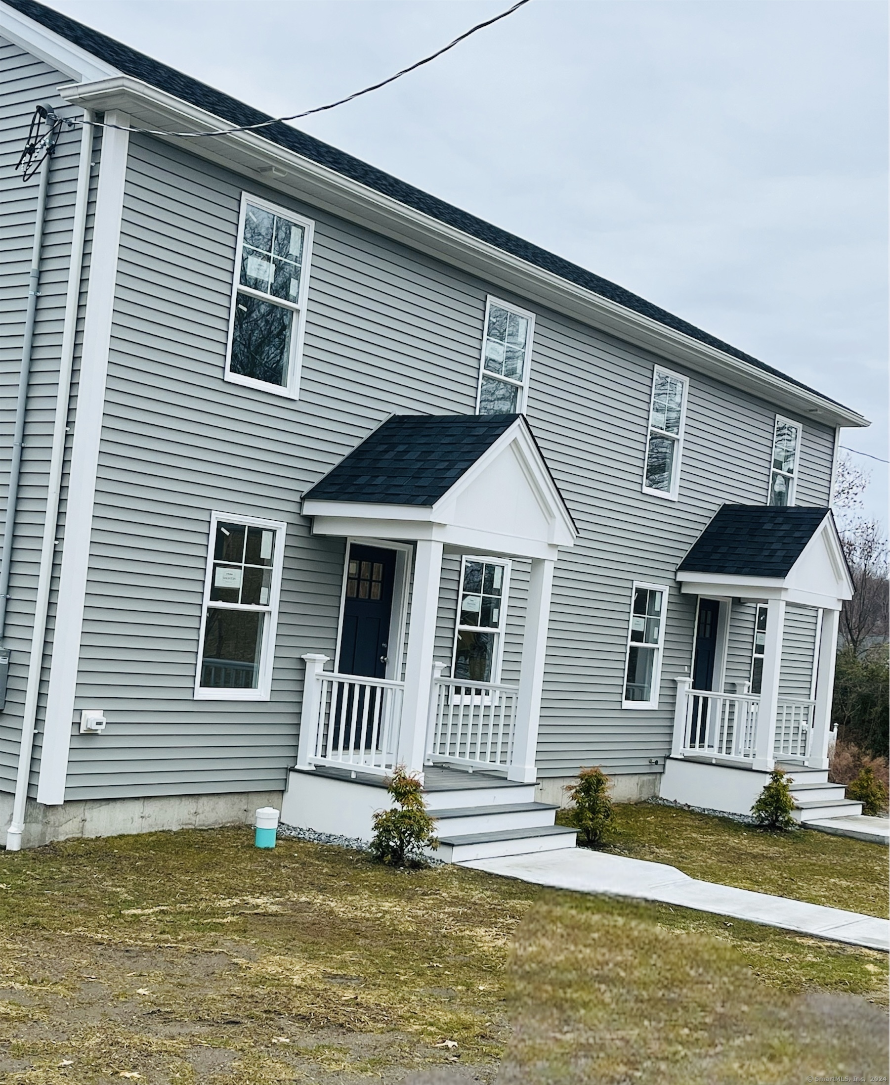 14 Infield Street Bridgeport, CT 06606 - Photo 1 of 8 a front view of a house with a yard