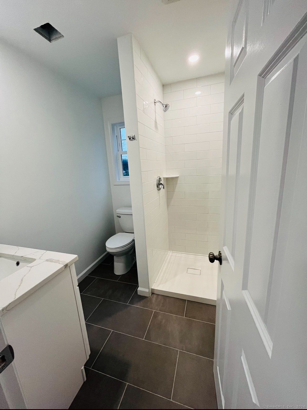 14 Infield Street Bridgeport, CT 06606 - Photo 3 of 8 a bathroom with a shower and a toilet