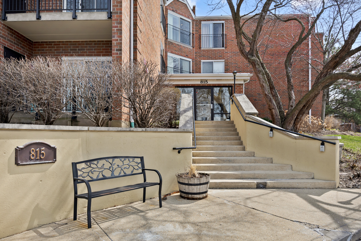815 Leicester Road, Unit 114A Elk Grove Village, IL 60007 - Photo 2 of 20 a view of a chairs setting on the side of the road