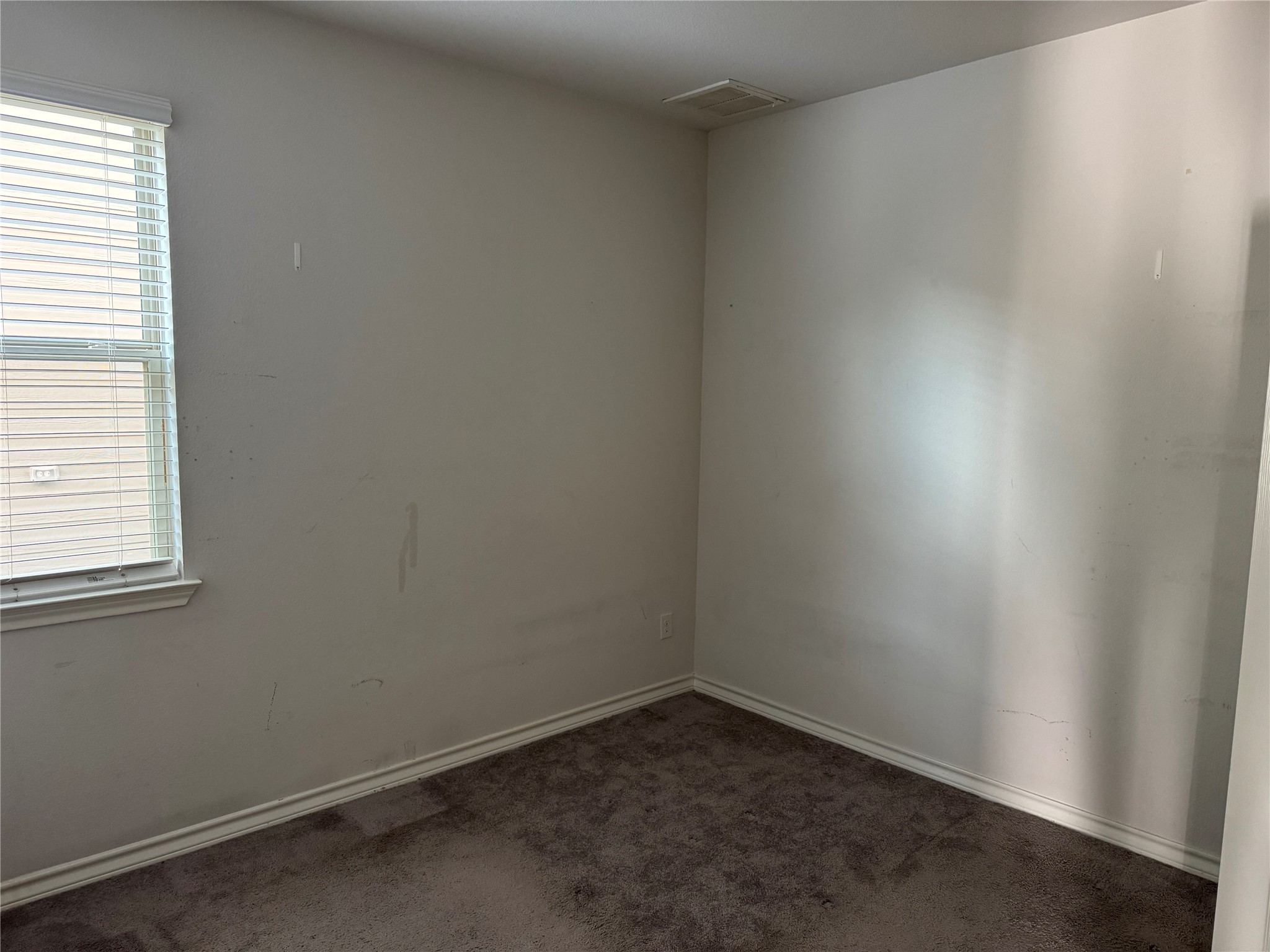 333 Capstone Road Liberty Hill, TX 78642 - Photo 7 of 40 Unfurnished room with dark carpet and baseboards
