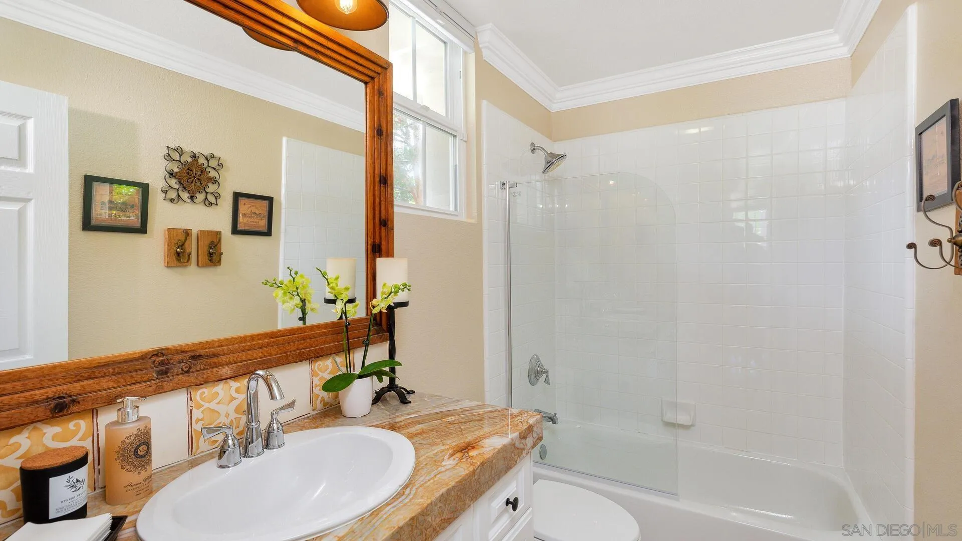694 Rihely Place Encinitas, CA 92024 - Photo 11 of 31 a bathroom with a granite countertop bathtub sink vanity mirror and toilet