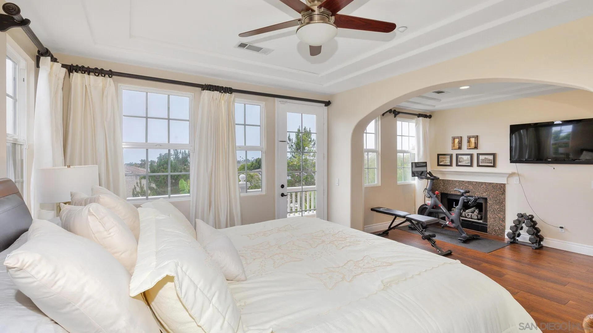 694 Rihely Place Encinitas, CA 92024 - Photo 14 of 31 a bedroom with a bed a large window and furniture