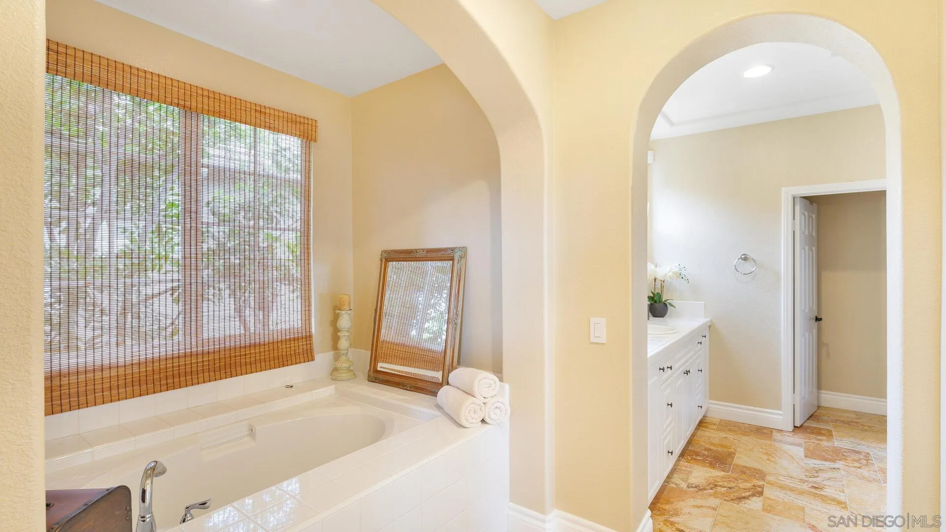 694 Rihely Place Encinitas, CA 92024 - Photo 15 of 31 a spacious bathroom with a tub and shower