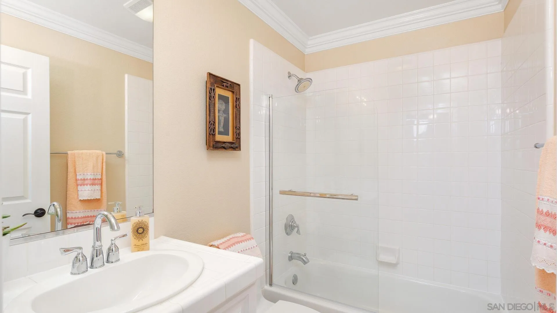 694 Rihely Place Encinitas, CA 92024 - Photo 24 of 31 a bathroom with a sink a mirror and a bathtub