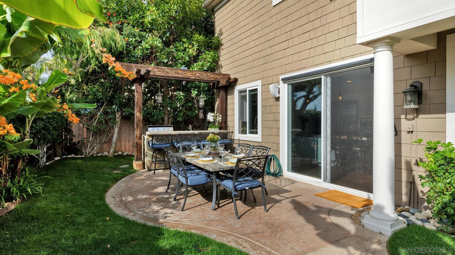 694 Rihely Place Encinitas, CA 92024 - Photo 28 of 31 a patio with a table and chairs and potted plants