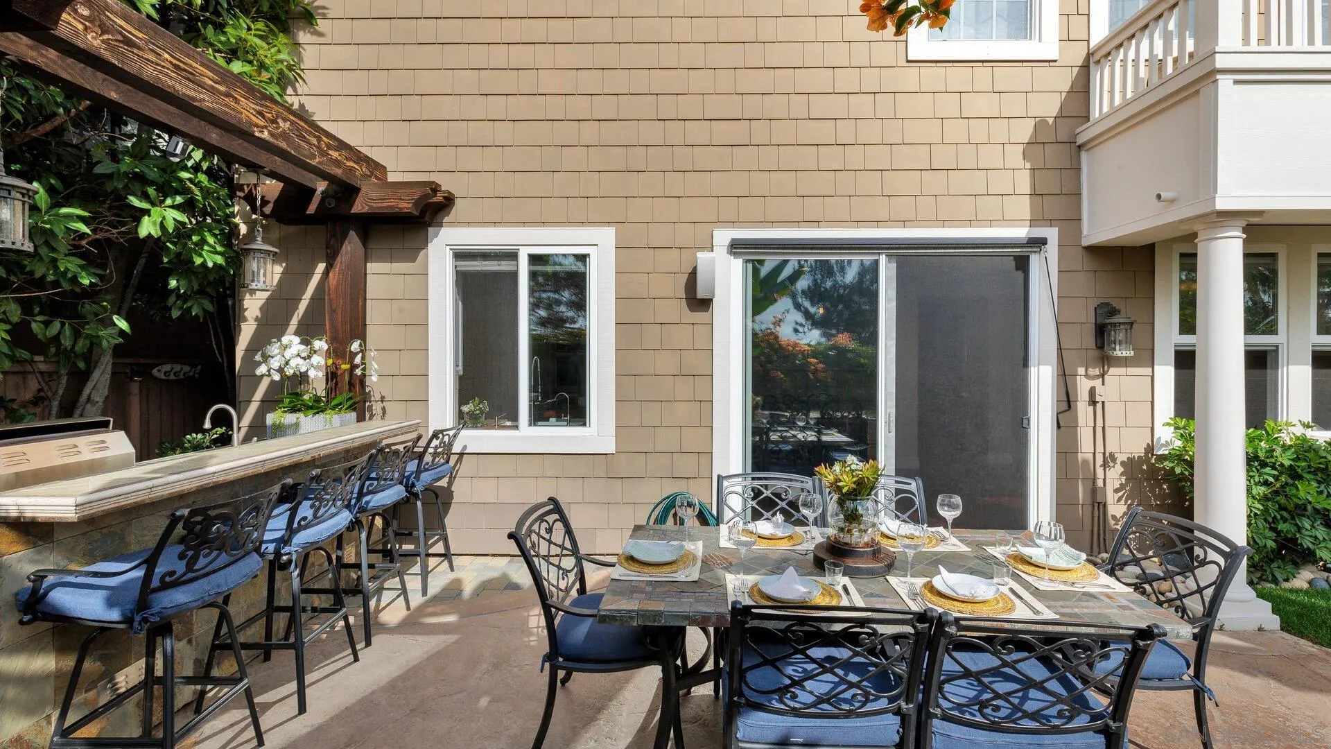 694 Rihely Place Encinitas, CA 92024 - Photo 29 of 31 a view of a patio with table and chairs and potted plants