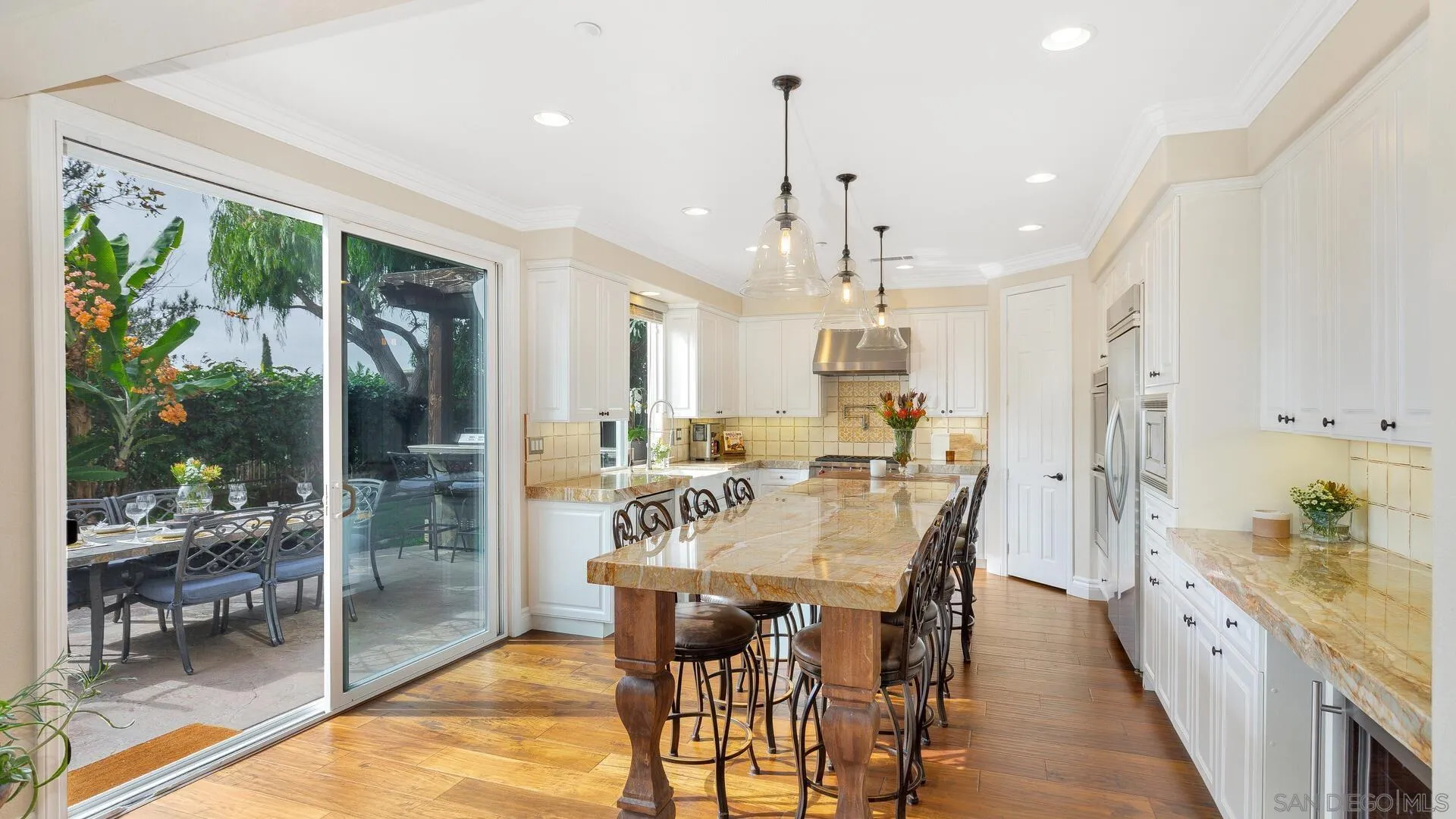 694 Rihely Place Encinitas, CA 92024 - Photo 6 of 31 a view of a dining room and livingroom with furniture wooden floor a chandelier