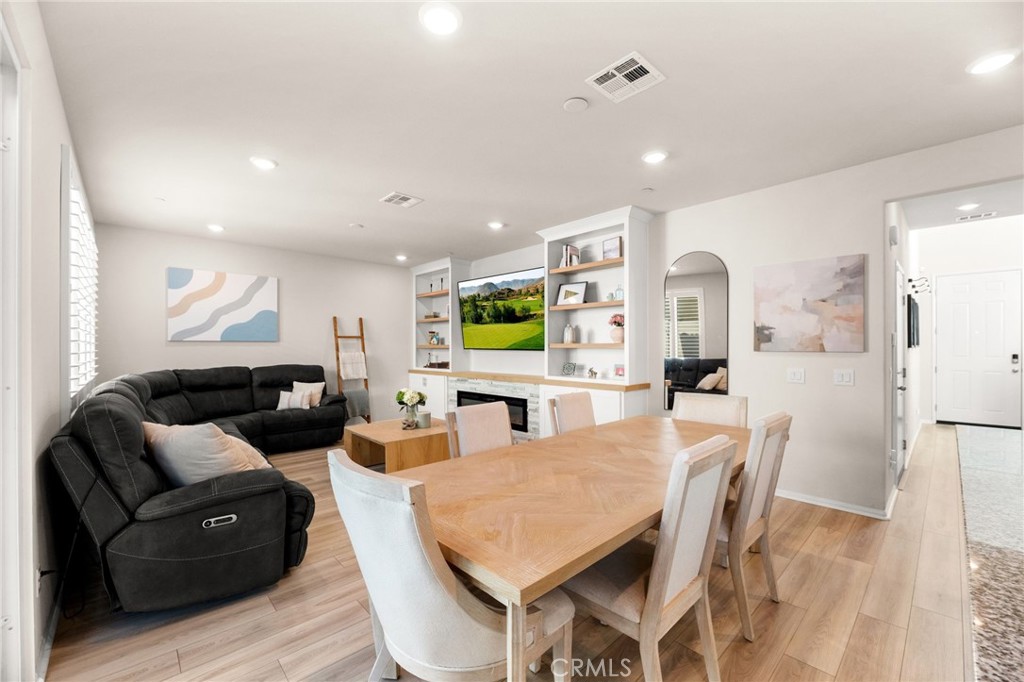 36362 Arcs Street Winchester, CA 92596 - Photo 20 of 54 a living room with furniture kitchen view and a wooden floor