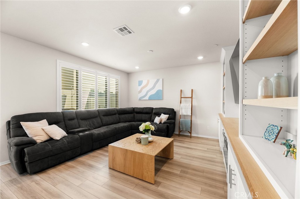 36362 Arcs Street Winchester, CA 92596 - Photo 24 of 54 a living room with furniture and a large window