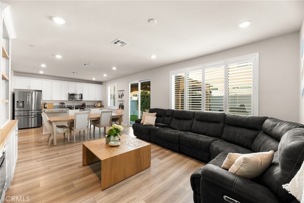 36362 Arcs Street Winchester, CA 92596 - Photo 26 of 54 a living room with furniture kitchen and a table
