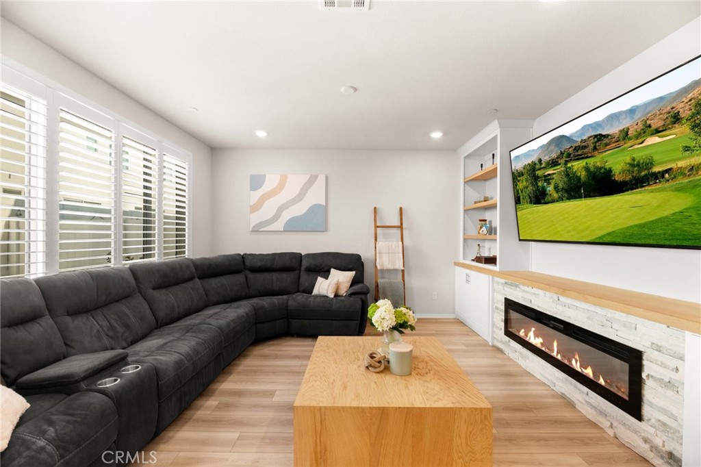 36362 Arcs Street Winchester, CA 92596 - Photo 27 of 54 a living room with furniture and a flat screen tv